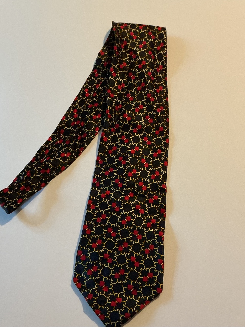Black Tie with Red and Gold Scroll Pattern
